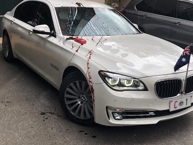 Refugee protesters have thrown red paint on Prime Minister Scott Morrison's car during his visit to the University of Queensland, October 12, 2020. Picture: Twitter via NCA NewsWireSource: https://twitter.com/RSMeanjin/status/1315443573521702914/photo/1