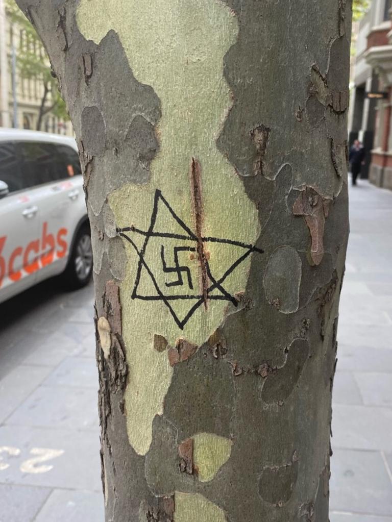 The swastika scrawled on a tree outside an office in Collins Street, Melbourne, on March 3, 2021. Picture: Supplied
