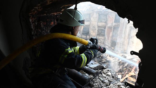 A firefighter intervene in the rubble of the Culture Palace destroyed by Russian missile strike in Kharkiv. Picture: AFP