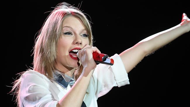 Happy to talk as well as sing and dance ... Taylor Swift in concert at Allianz Stadium, Sydney. Picture: Attila Szilvasi.