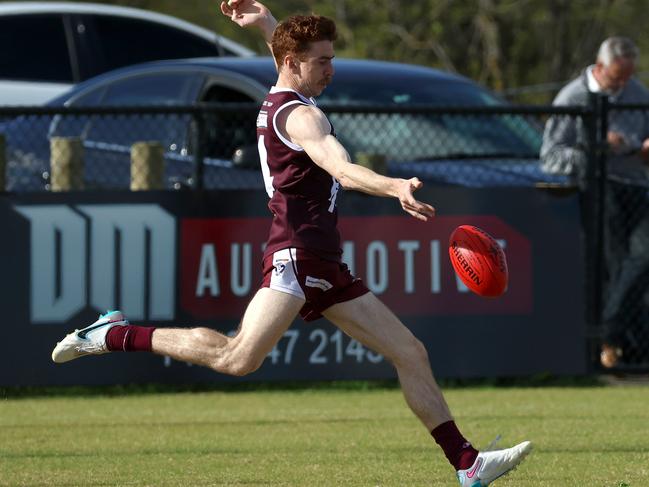 Jordyn Cotter gets a kick for Melton. Picture: Hamish Blair