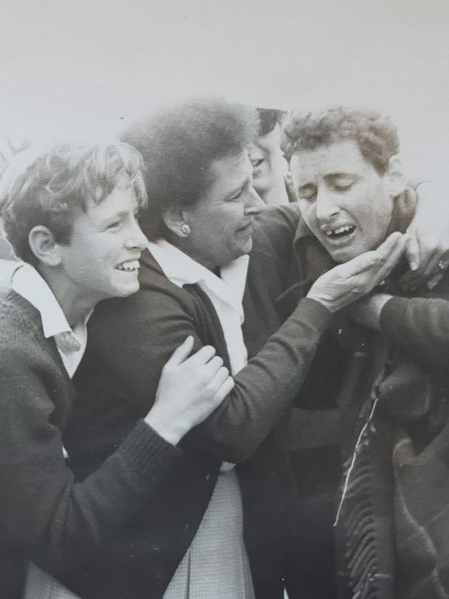 Murray Williams celebrates with his mum and brother after winning the Victorian marathon as a teenager. SUPPLIED