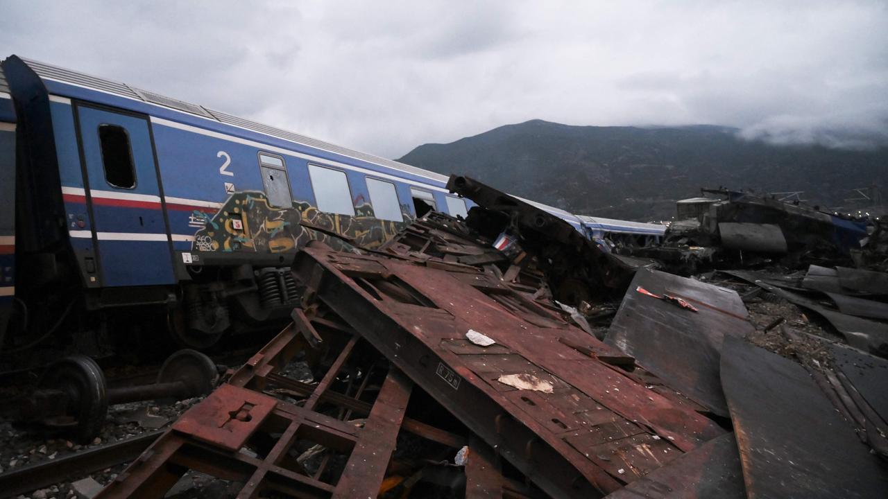 Wrecked wagons and mangled pieces of metal are seen near the tracks after the accident. Picture: Sakis Mitrolidis / AFP