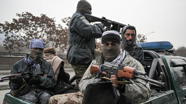 Taliban fighters patrol along a street during a demonstration by people to condemn the recent protest by the Afghan women's rights activists, in Kabul on January 21, 2022. Picture: Mohd RASFAN/AFP