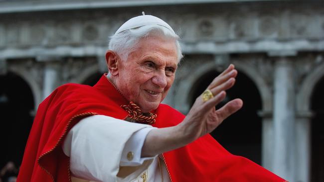 Then Pope Benedict XVI greets the crowd gathered in St Mark's Square in Venice in 2011. Picture: Getty Images