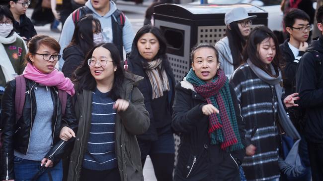 Chinese students support our education industry and the inner city apartment market. Both stand to suffer in a US-China trade war. Pic: Tony Gough