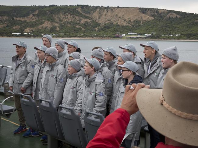 The choir from St Joseph's College Gregory Terrace in Queensland sing on a boat off Anzac Cove on the Gallipoli peninsula, Turkey. Picture: Ella Pellegrini