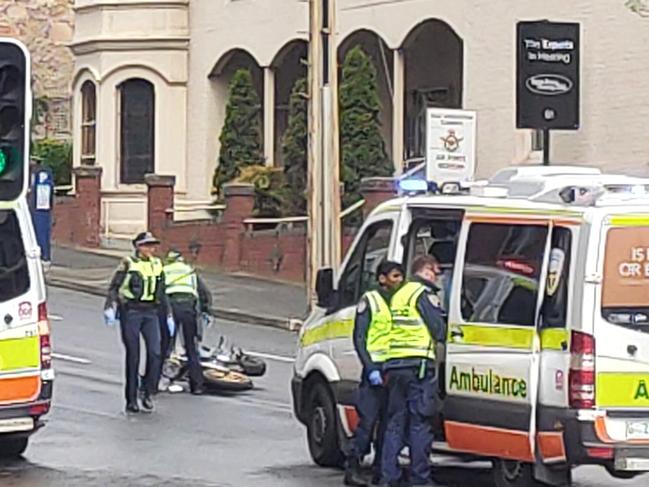 Crash between a motorcyclist and a pedestrian on the corner of Davey and Harrington Streets, Hobart.