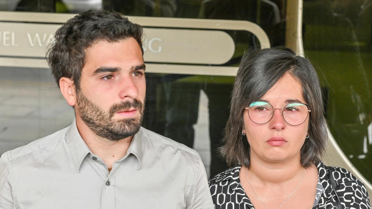 Italian travel blogger Gabriele Cairo, who caused the death of three members of the same family in a horror triple fatal car crash, leaves the Adelaide District Court with his wife Elena Perrone on Friday. Picture: NewsWire / Brenton Edwards