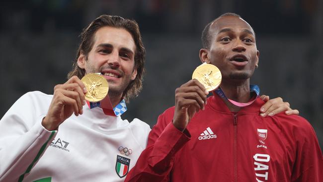 Joint gold medallists Gianmarco Tamberi of Team Italy and Mutaz Essa Barshim of Team Qatar on the podium during the medal ceremony for the Men's High Jump at the Tokyo 2020 Olympic Games. Picture: Getty Images