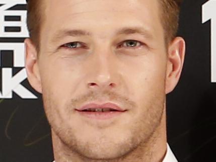 Australian actor Luke Bracey poses for photographers during a red carpet event for the movie "Point Break" in Beijing, Tuesday, Dec. 1, 2015. (AP Photo/Mark Schiefelbein)