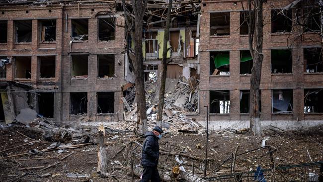 A man walks in front of a destroyed building after a Russian missile attack in the town of Vasylkiv, near Kyiv. Picture: AFP