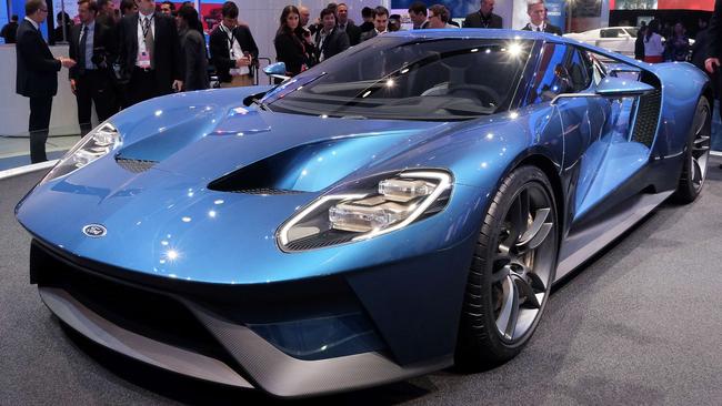 The new Ford GT is pictured at The North American International Auto Show in Detroit, Michigan, on January 12, 2015. Ford attempted to land a knock-out blow to its rivals at the Detroit auto show in revealing a dazzling new GT supercar. The annual car show takes place amid a surging economy, more jobs and cheap gas, a trifecta of near-perfect conditions for the US auto industry. AFP PHOTO/JEWEL SAMAD