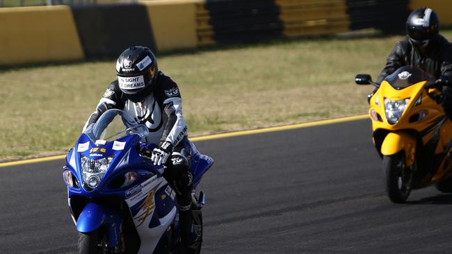 Blind motorcyclist Ben Felton giving a demonstration on his motorbike at Sydney Motorsport Park in Eastern Creek..