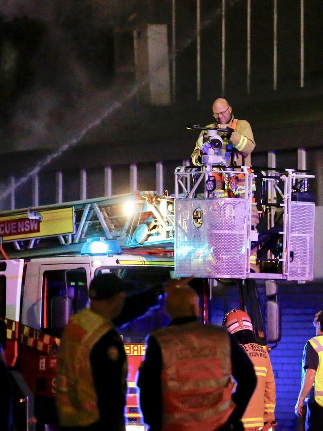 Aerial firefighter at the scene. Picture: Steve Tyson