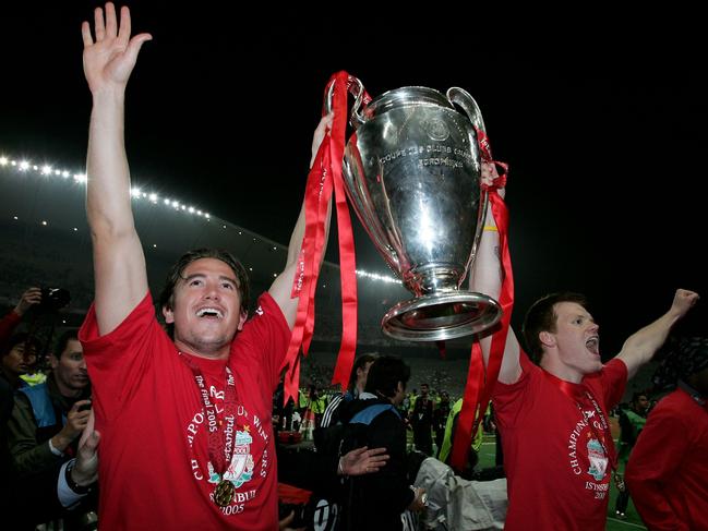 ISTANBUL, TURKEY - MAY 25: Liverpool defender John Arne Riise of Norway (R) and winger Harry Kewell of Australia lifts the European Cup after Liverpool won the European Champions League against AC Milan on May 25, 2005 at the Ataturk Olympic Stadium in Istanbul, Turkey. (Photo by Clive Brunskill/Getty Images)