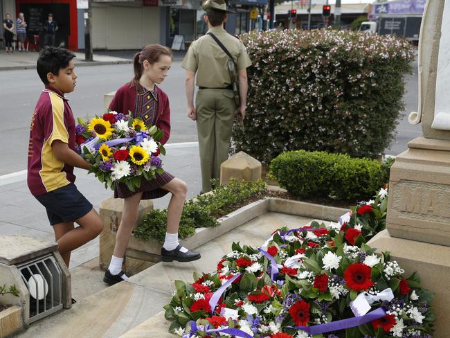 Local schoolchildren laying wreaths at the Riverstone cenotaph. Picture: David Swift