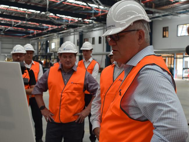 The PM inspects concepts of the munitions factory with MP Llew O’Brien. Photo: Stuart Fast