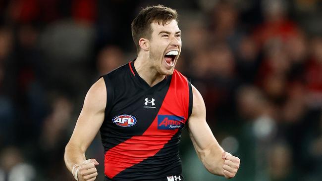 MELBOURNE, AUSTRALIA - JULY 09: Zach Merrett of the Bombers celebrates a goal during the 2023 AFL Round 17 match between the Essendon Bombers and the Adelaide Crows at Marvel Stadium on July 9, 2023 in Melbourne, Australia. (Photo by Michael Willson/AFL Photos via Getty Images)