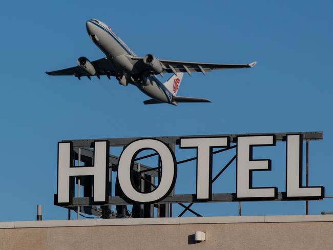 LONDON, ENGLAND - JANUARY 25: An airplane passes over a Sofitel hotel as it takes off from a runway at Heathrow Airport on January 25, 2021 in London, England. The mayor of London is among those who have called for arriving travelers to be quarantined in hotel rooms upon arrival to the UK, in an effort to prevent new strains of the virus that causes Covid-19 from taking hold here. In other countries that have adopted this policy, travelers must pay for their accommodation in designated hotels and are delivered their meals during the period. (Photo by Chris J Ratcliffe/Getty Images)