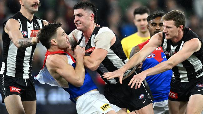 Jack Viney confronts Brayden Maynard after Angus Brayshaw was knocked out during the finals match between Melbourne and Collingwood at the MCG. Picture: Getty Images