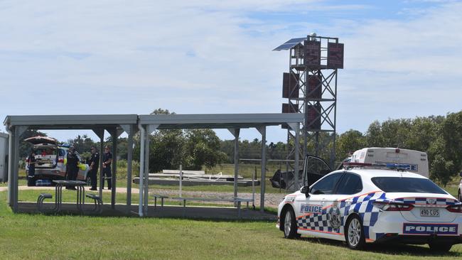 Police investigate the scene on the banks of the Burnett River and interview boaties following a serious boat crash.