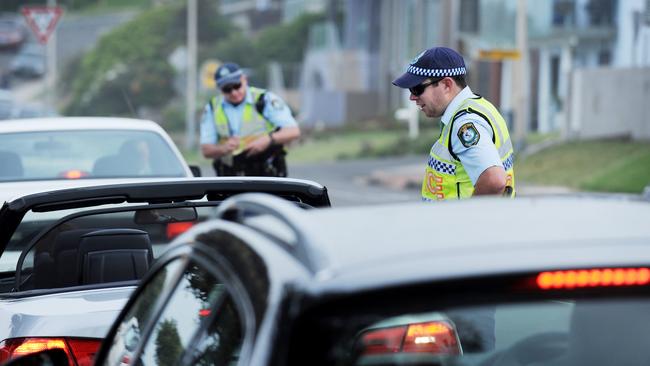 Police perform a random breath test.