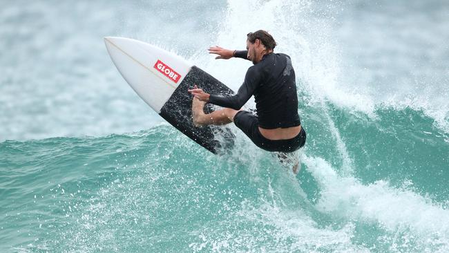 Surf's up... wind's up, crowd numbers up. Hundreds of surfers flock to Snapper Rocks. Picture by Scott Fletcher