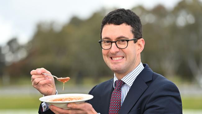 Speaker Dan Cregan poses with baked beans, which he said he would accept as payment for the parliamentary umpire’s job. Picture: Keryn Stevens