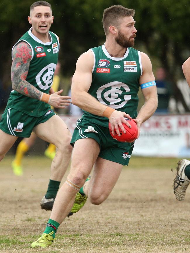 Zak McCubbin on the run for Greensborough. Picture: Hamish Blair