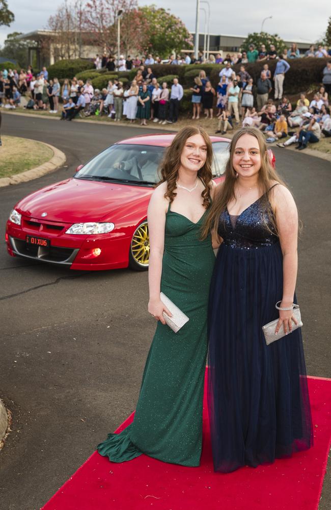 Emily Burchardt (left) and Ashley Webber at Harristown State High School formal at Highfields Cultural Centre, Friday, November 17, 2023. Picture: Kevin Farmer