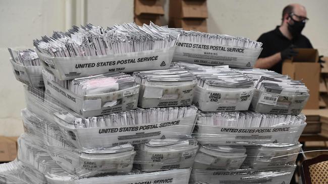 Mail-in ballots in their envelopes await processing as the US braces for days of post-election uncertainty after the Supreme Court rules that counting can continue after polling day in some key states. Picture: AFP