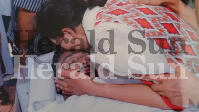 Sofia Sam weeps over the body of her husband Sam Abraham.