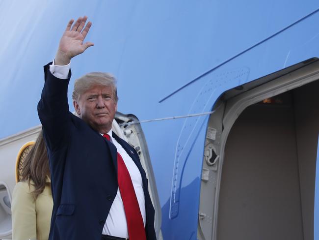 U.S. President Donald Trump waves when boarding Air Force One as he leaves from the airport in Helsinki, Finland, Monday, July 16, 2018, after the meeting with Russian President Vladimir Putin in the Finnish capital. (AP Photo/Pablo Martinez Monsivais)