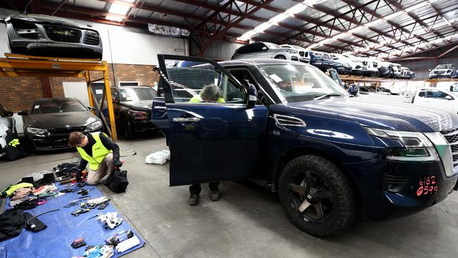 A 2020 Nissan Patrol wagon being combed over by Sharps Australia vehicle safety inspectors. Picture: David Clark