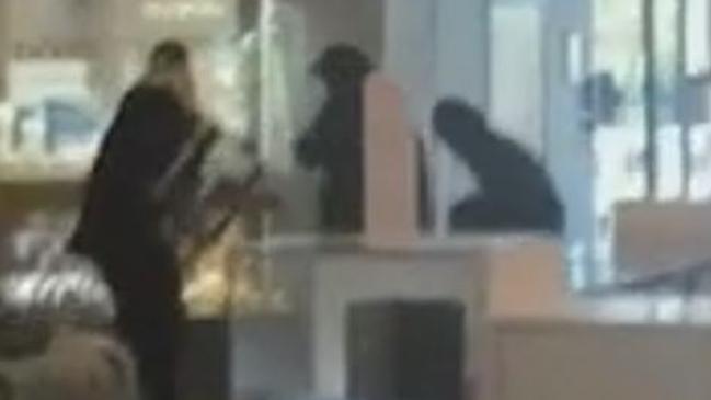 Vision of the thieves smashing into the jewellery store. Vision courtesy 7 News