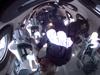 This handout photo courtesy Of Virgin Galactic shows Sir Richard Branson(C) and other Unity 22 crew members at zero gravity, viewed as they flew into space aboard a Virgin Galactic vessel, a voyage he described as the "experience of a lifetime" -- and one he hopes will usher in an era of lucrative space tourism at Spaceport America, near Truth and Consequences, New Mexico on July 11, 2021. - "Congratulations to all our wonderful team at Virgin Galactic for 17 years of hard, hard work to get us this far," he said during a live feed as the VSS Unity spaceship glided back to Spaceport America in New Mexico.It reached a peak altitude of around 53 miles (85 kilometers) -- beyond the boundary of space, according to the United States -- allowing the passengers to experience weightlessness and admire the Earth's curvature.The trip proceeded without drama, and touchdown occurred at around 9:40 am Mountain Time (1540 GMT), about an hour after take-off. (Photo by Patrick T. FALLON / Virgin Galactic / AFP) / RESTRICTED TO EDITORIAL USE - MANDATORY CREDIT "AFP PHOTO /VIRGIN GALATIC/HANDOUT " - NO MARKETING - NO ADVERTISING CAMPAIGNS - DISTRIBUTED AS A SERVICE TO CLIENTS