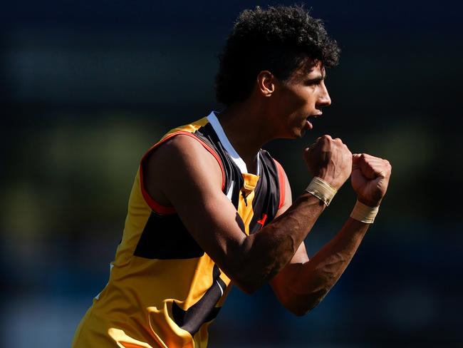 Dandenong’s Sam Latreille celebrates kicking a goal.