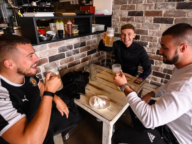 A group of men drinking beer at 'Soy Restaurant' in Bondi Beach, Sydney, Friday, May 15, 2020. Pubs, clubs, cafes, restaurants, and places of worship are now able to welcome up to 10 people inside their doors under an easing of NSW's COVID-19 restrictions. (AAP Image/James Gourley) NO ARCHIVING