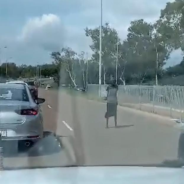 A woman was standing in the middle of the road at the Narrows on Wednesday.