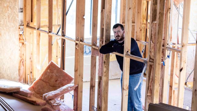 Edward Gilmore inside his unfinished home. Picture: Kelly Barnes