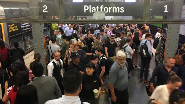 It was also a hot wait for commuters on platforms at Town Hall Station. Picture: Henry Lynch