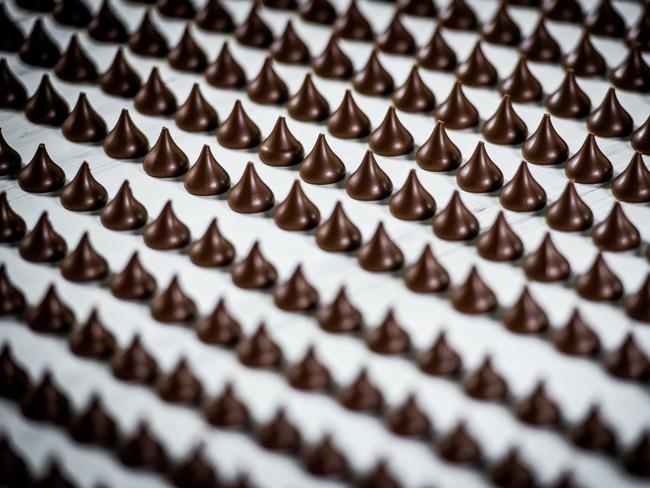 Hershey Kisses move along the production line at the West Hershey plant in Hershey.