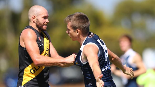 Glenelg’s Aaron Joseph wrestles with South’s Joel Cross at Noarlunga. Picture: TAIT SCHMAAL.