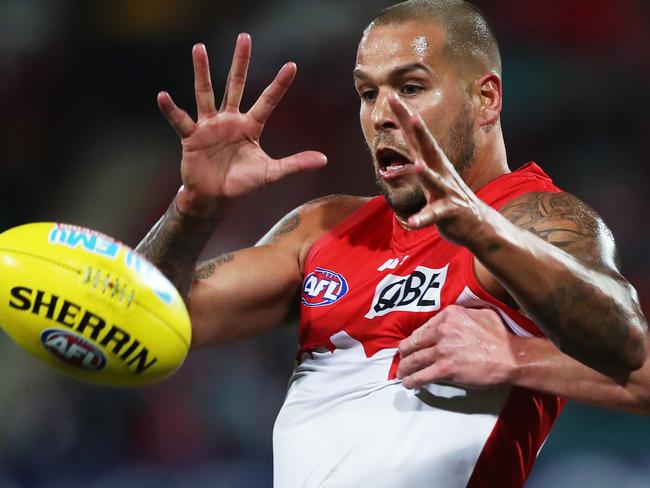 Sydney's Lance Franklin and Melbourne's Sam Frost during AFL match between the Sydney Swans and Melbourne Demons at the SCG. Picture. Phil Hillyard