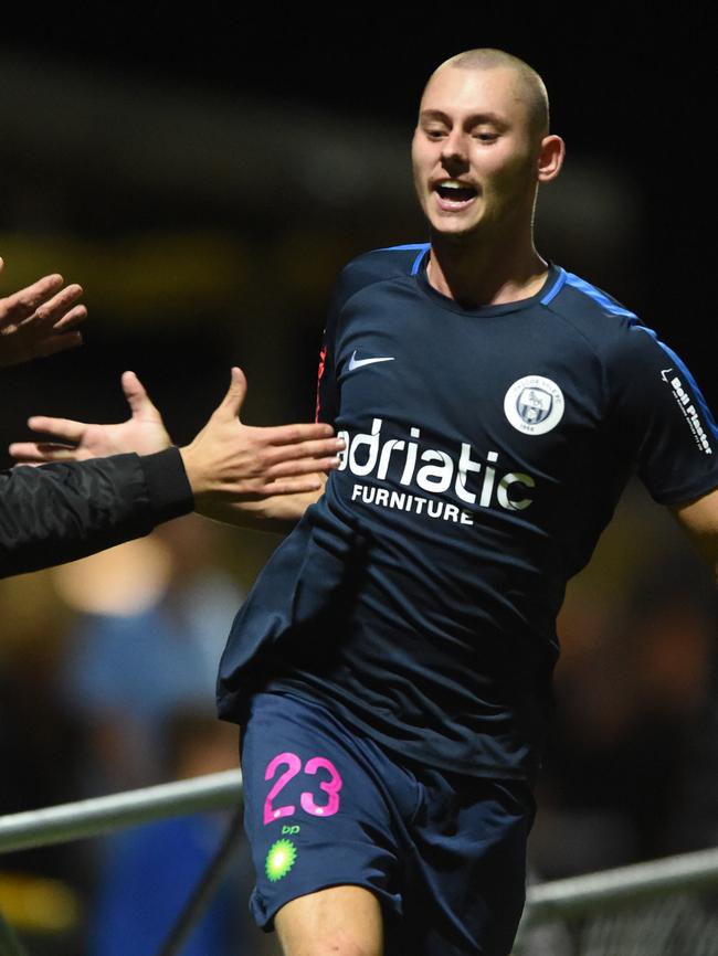 Amir Osmancevic high fives the crowd after scoring on his Pascoe Vale debut on Saturday. Picture: Chris Eastman.