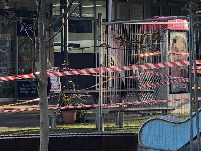 Northern Beaches Council taped off a children's playground at the Killarney Heights shopping precinct in Tremore Pl on Thursday, April 11, 2024, ahead of an urgent clean-up of fragments of asbestos that had broken off a shop awning.