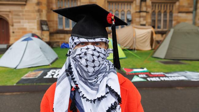 A Pro-Palestinian protester at Sydney University on Friday, donning a checkered scarf. Picture: NCA NewsWire/David Swift