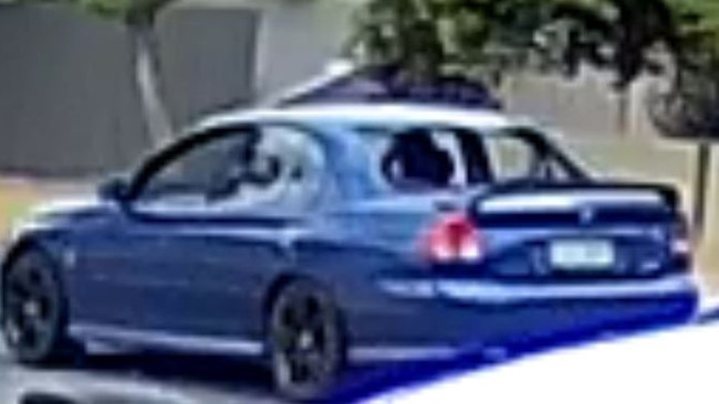 CCTV footage shows the blue Holden travelling along a road with smashed windows. Photo: Courts SA