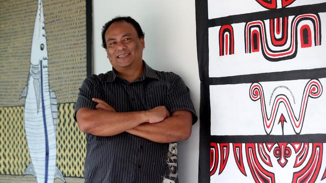 UMI Arts artist Tommy Pau with some of his acrylic on linen works on display in The Freshwater Saltwater Exhibition at UMI Arts. PICTURE: STEWART MCLEAN